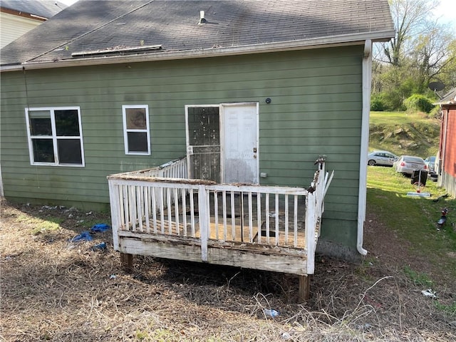 back of property featuring a wooden deck