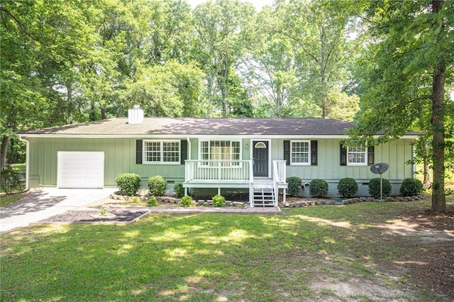 879 Rock Oak Ln, Lawrenceville, GA 30046 - ranch-style home with covered porch, an attached garage, concrete driveway, and a front lawn