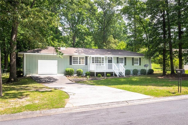 879 Rock Oak Ln, Lawrenceville, GA 30046 - ranch-style home with a porch, a garage, a front lawn, and driveway