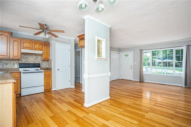 879 Rock Oak Ln, Lawrenceville, GA 30046 - kitchen featuring white range with electric stovetop, under cabinet range hood, light wood-style floors, ceiling fan, and decorative backsplash