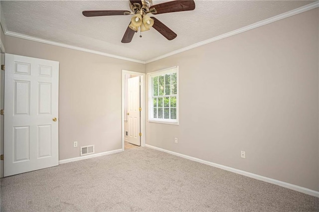 879 Rock Oak Ln, Lawrenceville, GA 30046 - carpeted empty room with baseboards, a ceiling fan, a textured ceiling, and crown molding
