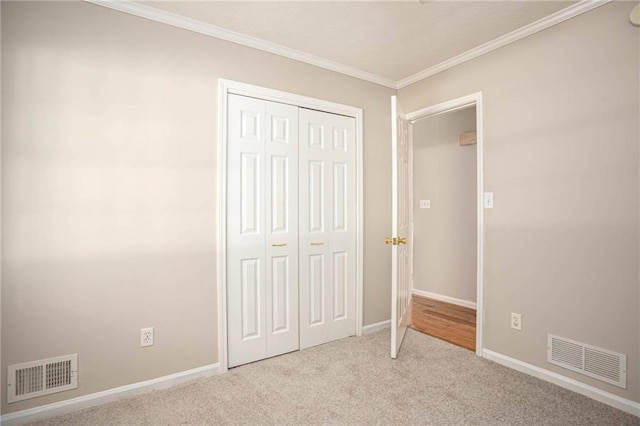 879 Rock Oak Ln, Lawrenceville, GA 30046 - unfurnished bedroom featuring carpet floors, baseboards, crown molding, and a closet