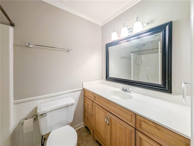 879 Rock Oak Ln, Lawrenceville, GA 30046 - bathroom with ornamental molding, a shower, toilet, vanity, and wainscoting