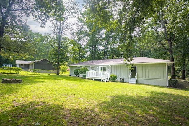 879 Rock Oak Ln, Lawrenceville, GA 30046 - back of house featuring entry steps, a fire pit, and board and batten siding