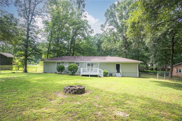 879 Rock Oak Ln, Lawrenceville, GA 30046 - rear view of property featuring an outdoor fire pit