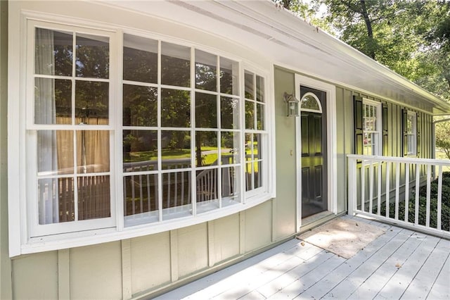 879 Rock Oak Ln, Lawrenceville, GA 30046 - doorway to property with board and batten siding and covered porch