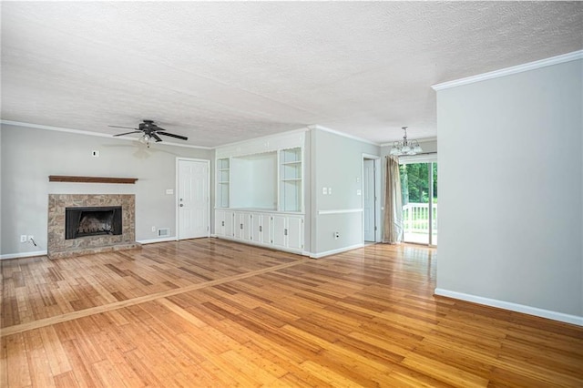 879 Rock Oak Ln, Lawrenceville, GA 30046 - unfurnished living room featuring hardwood / wood-style flooring, a chandelier, ceiling fan, crown molding, and baseboards