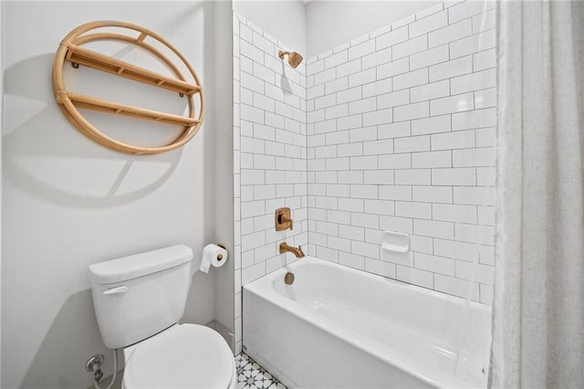 bathroom with toilet and shower / bath combo