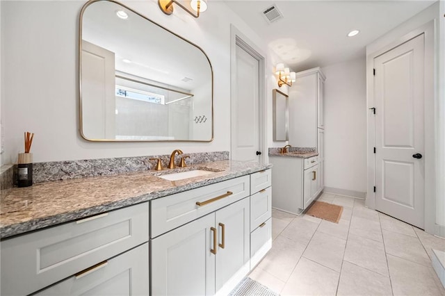 bathroom with vanity, visible vents, recessed lighting, tile patterned flooring, and a shower with door