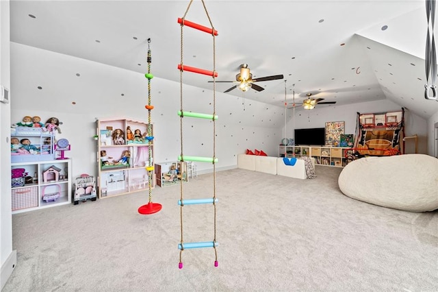 rec room featuring vaulted ceiling, carpet, and ceiling fan