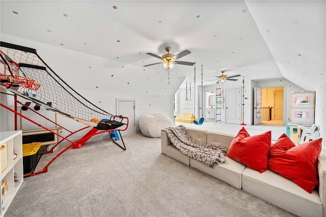 playroom with carpet flooring, a ceiling fan, and lofted ceiling