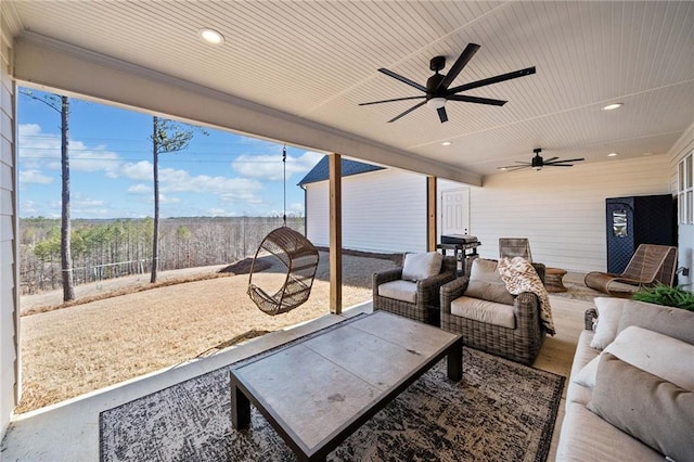 view of patio / terrace featuring an outdoor living space, a ceiling fan, and fence