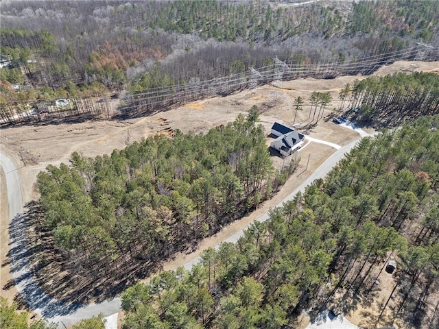 bird's eye view featuring a forest view