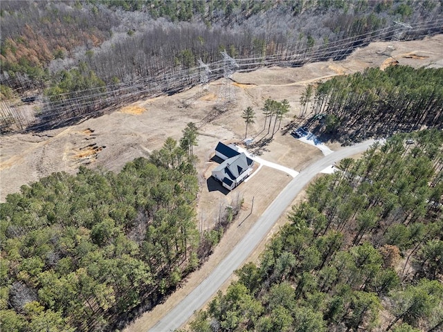 aerial view featuring a view of trees