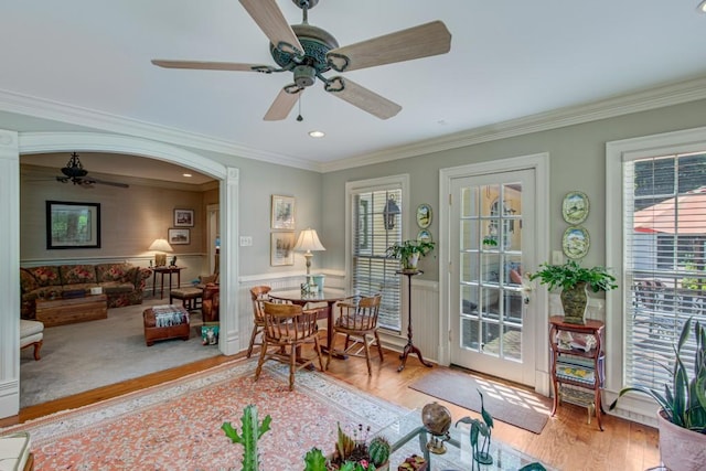 interior space featuring ornamental molding, light hardwood / wood-style flooring, and a healthy amount of sunlight