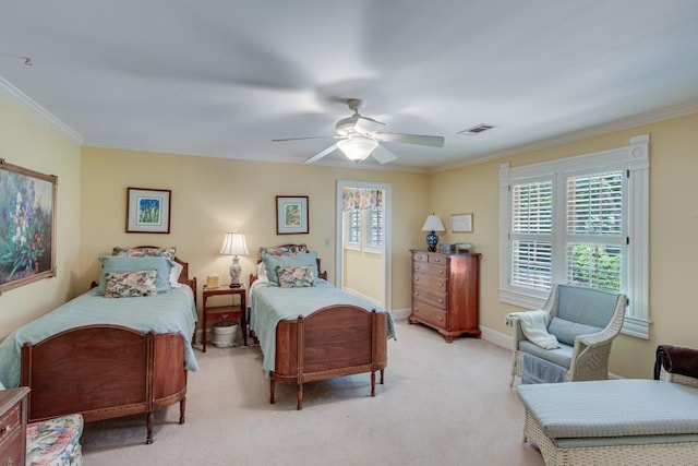 carpeted bedroom featuring ceiling fan and crown molding