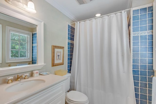 bathroom with toilet, a shower with curtain, ornamental molding, and vanity