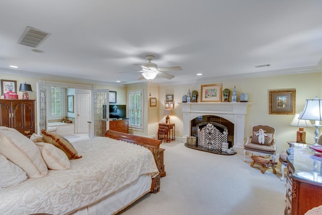 carpeted bedroom featuring ceiling fan and ornamental molding