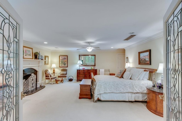 carpeted bedroom featuring ceiling fan and crown molding