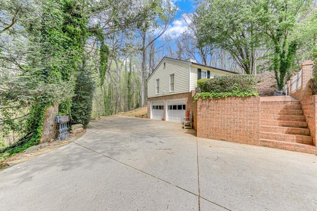 view of side of property featuring a garage