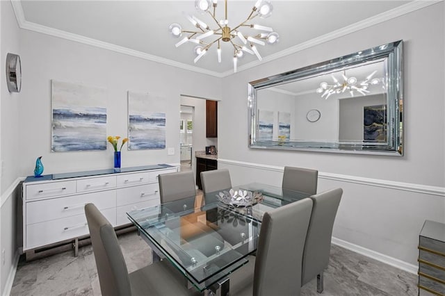 dining room with crown molding, baseboards, and a notable chandelier