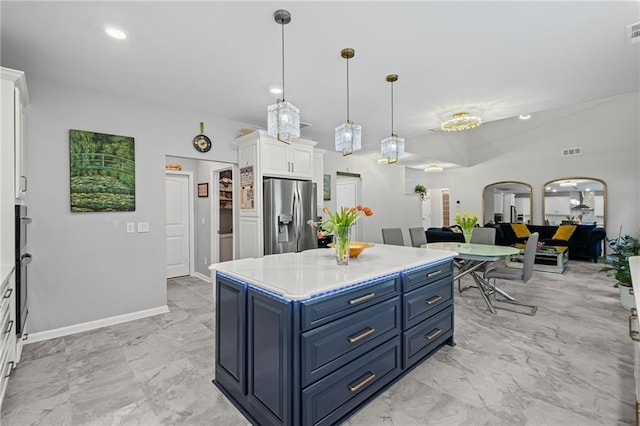 kitchen featuring blue cabinetry, visible vents, light countertops, stainless steel fridge with ice dispenser, and white cabinetry