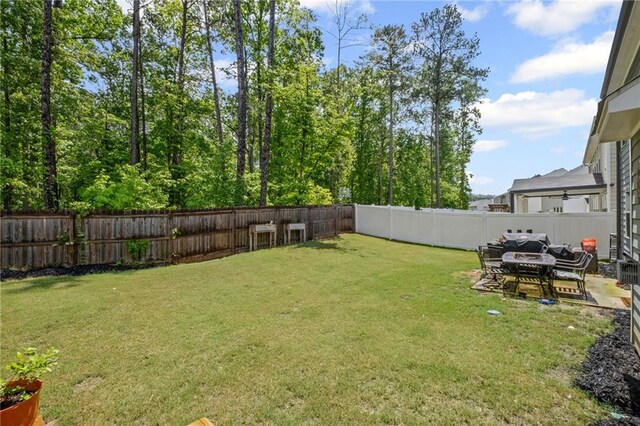 view of yard featuring a fenced backyard and a patio