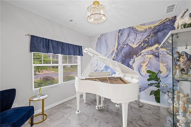 living area with baseboards, visible vents, and marble finish floor