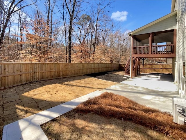 view of yard with stairs and fence