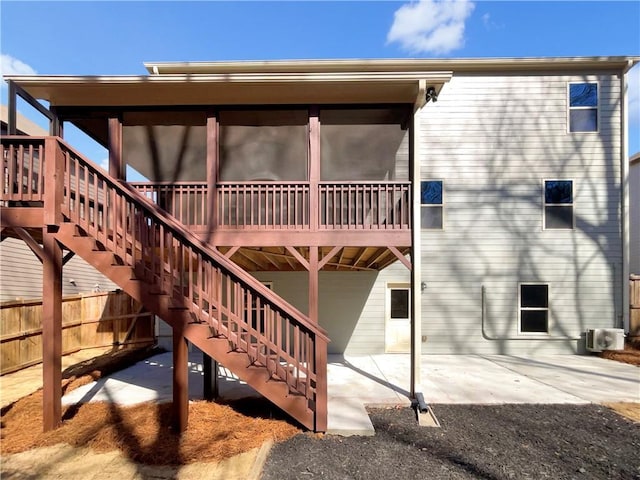 back of house with fence, stairway, and a patio