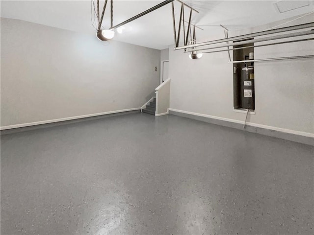 garage featuring baseboards and a garage door opener