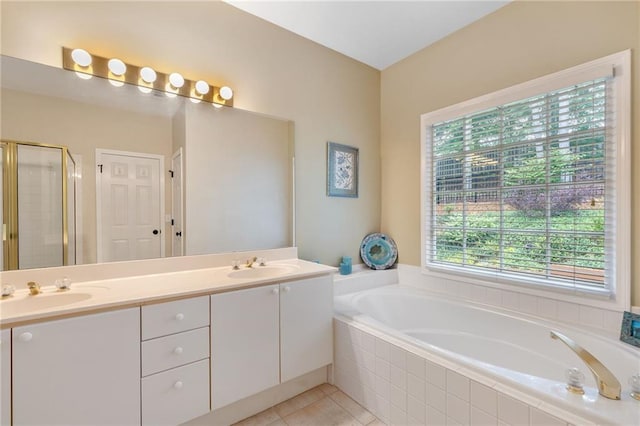 2905 Ivey Ridge Ln, Roswell, GA 30076 - bathroom with a garden tub, double vanity, a stall shower, and tile patterned floors