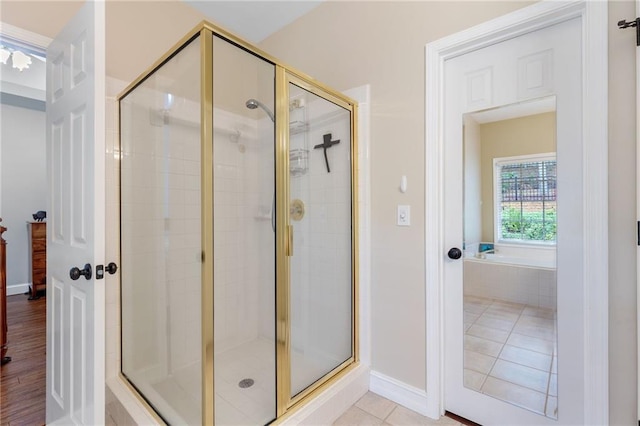2905 Ivey Ridge Ln, Roswell, GA 30076 - bathroom with a shower stall, a bath, and tile patterned flooring