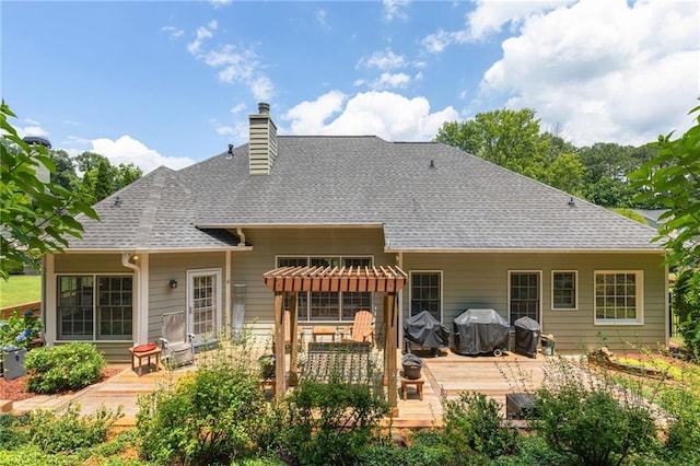 2905 Ivey Ridge Ln, Roswell, GA 30076 - rear view of house featuring a wooden deck, a chimney, and roof with shingles