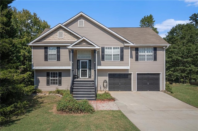 split foyer home featuring a front yard and a garage