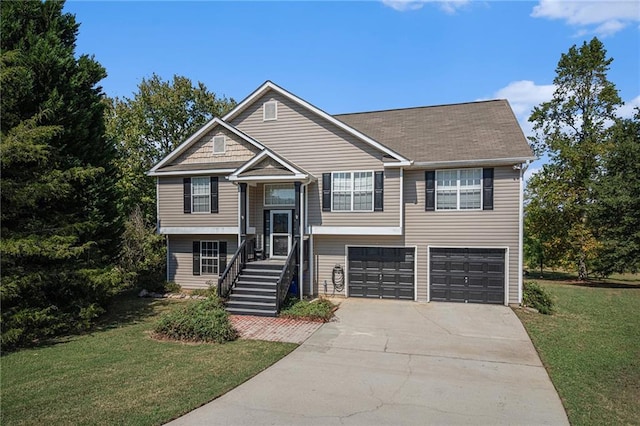 bi-level home with a garage and a front yard