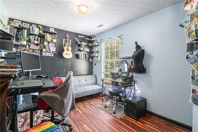 office space featuring wood-type flooring and a textured ceiling