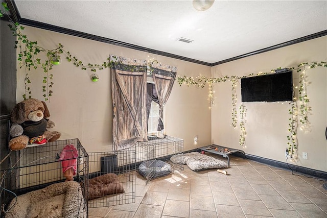 interior space featuring crown molding and light tile patterned floors