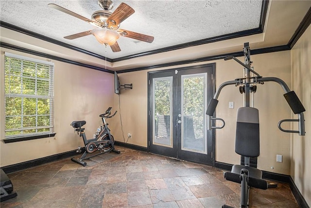 workout area with ceiling fan, a textured ceiling, crown molding, and french doors