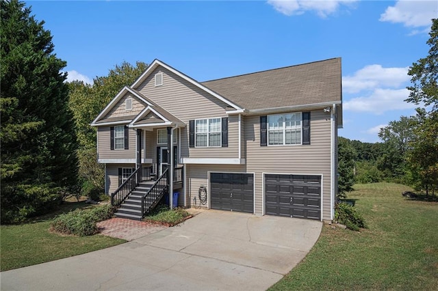 raised ranch with a front yard and a garage