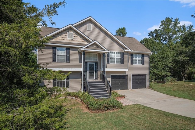 view of front of home with a front yard and a garage