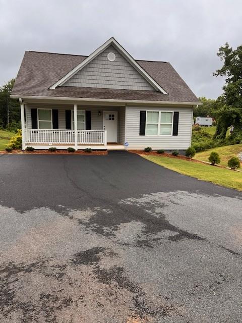 34 Great Works Dr, Dahlonega, GA 30533 - view of front of home featuring a porch and roof with shingles