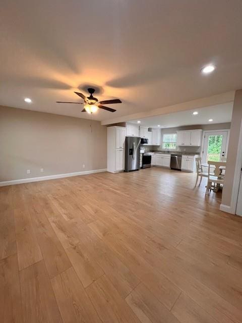 34 Great Works Dr, Dahlonega, GA 30533 - unfurnished living room featuring light wood finished floors, a ceiling fan, baseboards, and recessed lighting