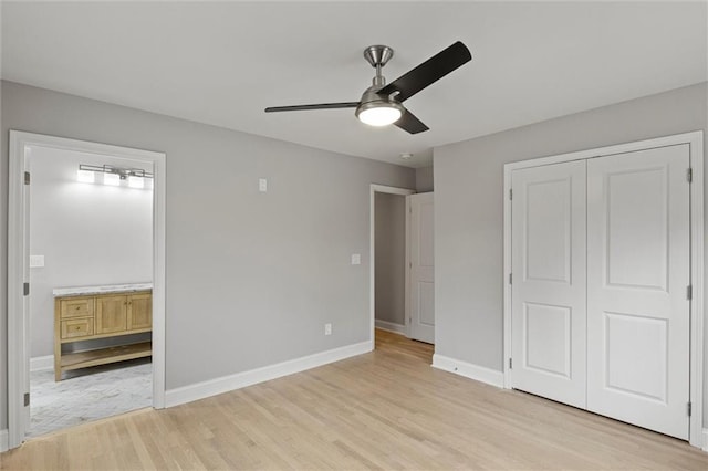 unfurnished bedroom with ceiling fan, a closet, and light hardwood / wood-style floors