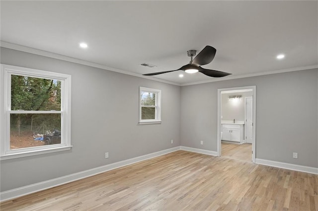 unfurnished bedroom featuring ceiling fan, ornamental molding, ensuite bathroom, and light hardwood / wood-style flooring