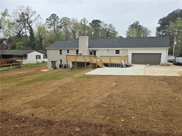 1320 Melbenan Dr, Atlanta, GA 30311 - back of house featuring a deck, fence, a yard, concrete driveway, and a garage