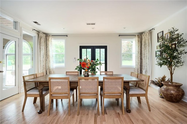 5102 Chastleton Dr, Stone Mountain, GA 30087 - dining space featuring light wood-style flooring, ornamental molding, and plenty of natural light