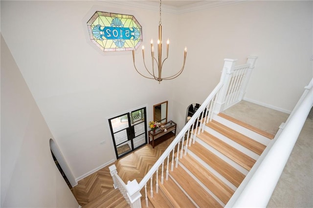 5102 Chastleton Dr, Stone Mountain, GA 30087 - stairs featuring a chandelier, baseboards, and a towering ceiling
