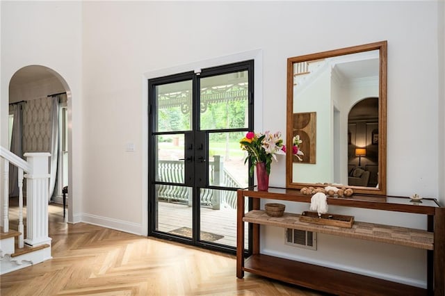 5102 Chastleton Dr, Stone Mountain, GA 30087 - doorway to outside featuring arched walkways, french doors, baseboards, and stairway