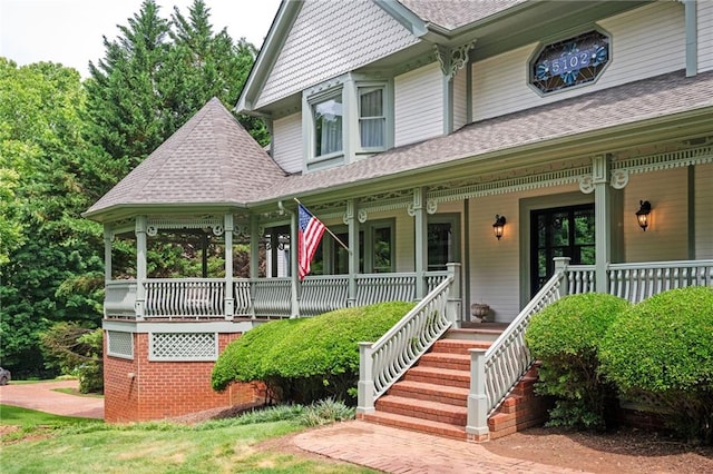 5102 Chastleton Dr, Stone Mountain, GA 30087 - victorian house featuring a shingled roof and covered porch